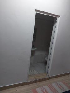 an open door to a bathroom with a toilet at 2 spacious bedrooms in Mombasa