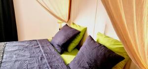 Ein Bett oder Betten in einem Zimmer der Unterkunft Ginger Villa Somone