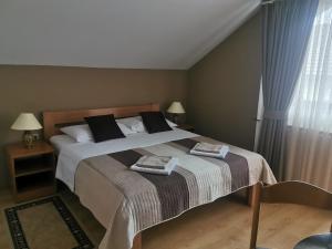 מיטה או מיטות בחדר ב-House Zlatko