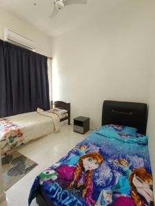 a bedroom with a bed with a blanket on it at Pro-Qaseh Room Stay , Darulaman Lake Home in Jitra