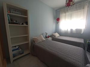 Postel nebo postele na pokoji v ubytování Precioso apartamento con terraza y vistas al mar + 2 fotografie
