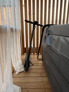a vacuum sitting on the floor next to a window at Rosmarin&Olive Premium Mobile Homes in Selce