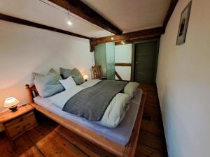 Postel nebo postele na pokoji v ubytování AuenGut-Bertsdorf