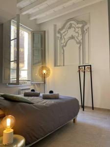 Posteľ alebo postele v izbe v ubytovaní Appartement avec ventilateurs proche du Palais des Papes