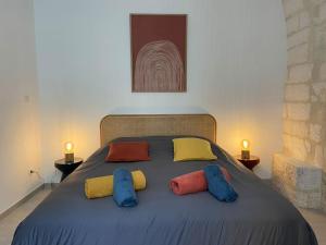 Posteľ alebo postele v izbe v ubytovaní Appartement avec ventilateurs proche du Palais des Papes