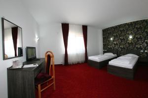 Postel nebo postele na pokoji v ubytování Hotel Rebis