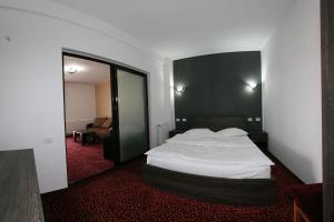 Postel nebo postele na pokoji v ubytování Hotel Rebis