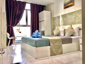 Postel nebo postele na pokoji v ubytování SaiGon CoZy Hotel "241 Pham Ngu Lao Street''