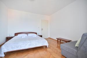 Postel nebo postele na pokoji v ubytování Apartmani Badurina - Maslina