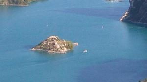 a small island in the middle of a large body of water at Mireille in Castellane