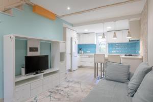 Televízia a/alebo spoločenská miestnosť v ubytovaní Bonita casa en urbanización privada muy cerca del mar y de Alicante