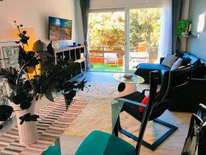a living room with a couch and a table at Villa Neptuno in Tossa de Mar