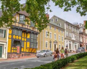 una rappresentazione di una strada con case e un'auto di Luxury 3BD Condo in the heart of Providence a Providence