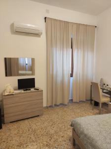 TV a/nebo společenská místnost v ubytování B&B 24 Maggio