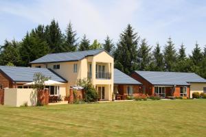 a home with solar panels on its roof at The Meadows Villa in Christchurch
