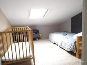 Posteľ alebo postele v izbe v ubytovaní Gîte Ambroise (proche Puy du fou)