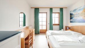 Ένα ή περισσότερα κρεβάτια σε δωμάτιο στο Hotel Corno Bianco