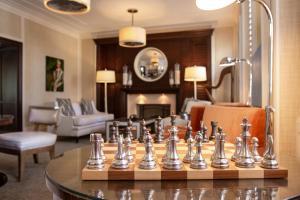 a chess board on a table in a living room at The Pillars Hotel & Club in Fort Lauderdale