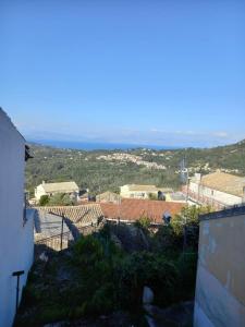 a view of a city from a building at Fofi in Áyioi Dhéka