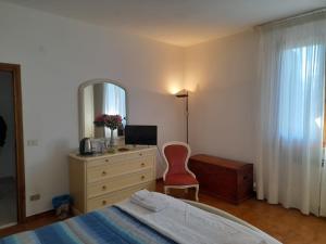 Giường trong phòng chung tại Villetta dei Lecci