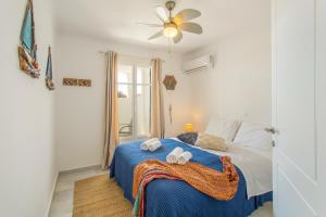 Postel nebo postele na pokoji v ubytování White Cliff 4 - Cycladic Home