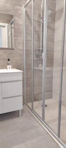 a bathroom with a shower and a sink at Quinta De Oliveiras in Beco