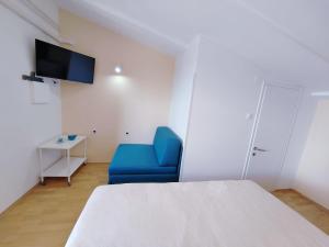 TV a/nebo společenská místnost v ubytování Guesthouse Resan