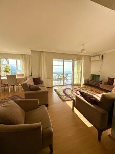 a living room with two couches and a television at Manzara dağevi in Rize