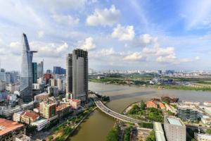 a view of a city with a river and buildings at Saigon Cozy Hotel in Ho Chi Minh City