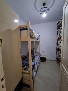 Μία ή περισσότερες κουκέτες σε δωμάτιο στο Appartement vue mer