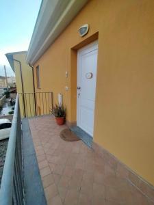 a door on the side of a house at Casa Moki in Uliveto Terme