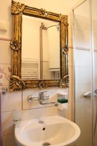 a bathroom with a sink and a mirror at Palić vila Maša pr Emina Stipancevic in Palić