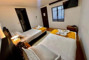 Cama o camas de una habitación en House Studio Hotel