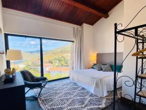 Ένα ή περισσότερα κρεβάτια σε δωμάτιο στο casa das ameias