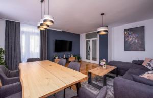 a living room with a couch and a table at Apartment Residence Narona in Mlini