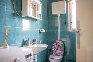 a bathroom with a toilet and a sink at Apartment SOUL in Knin +26 photos