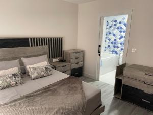 Ένα ή περισσότερα κρεβάτια σε δωμάτιο στο Apartamento Maitika +16 φωτογραφίες