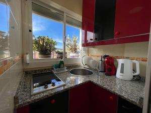Kuchyň nebo kuchyňský kout v ubytování Cozy studio centr Torremolinos