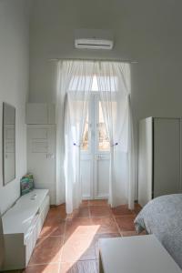 Uma cama ou camas num quarto em Casa Vacanze Ulisse