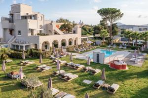 an aerial view of a resort with lounge chairs and a pool at Insula Boutique Hotel in Procida