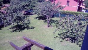 a park with trees and a bench in a yard at La Quintana de Mary in Aramil de Arriba +18 photos