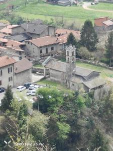 an aerial view of a small town with a church at Ca del tita in Capo di Ponte