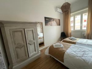 Кровать или кровати в номере Gregorio VII Vatican House