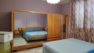 A bed or beds in a room at Relax in collina a due passi dal mare