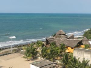 a view of the beach from the balcony of a resort at Apartment in Sirenis Atacames in Tonsupa