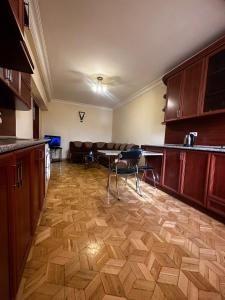 a room with a kitchen with a table and chairs at Nice Apartment in Koghbaci Street in Yerevan
