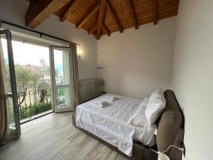 a bedroom with a bed and a large window at Villa dei sogni in Bellagio +117 photos