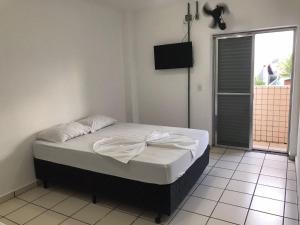 Cama ou camas em um quarto em Pousada dos Eletricitarios mais 8 fotos