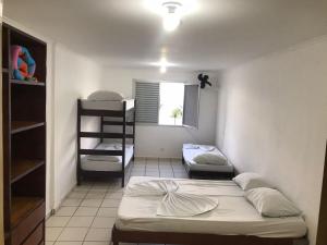 Cama ou camas em um quarto em Pousada dos Eletricitarios