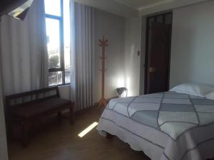 Postel nebo postele na pokoji v ubytování Roma Hostal